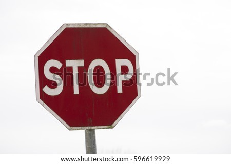 Red stop sign with white writing Irish Road Signs