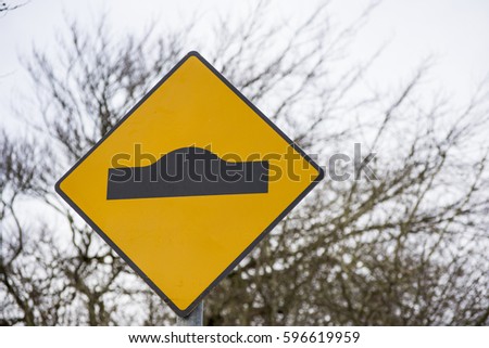 Ramps ahead sign - Yellow and black with rural background Irish Road Signs