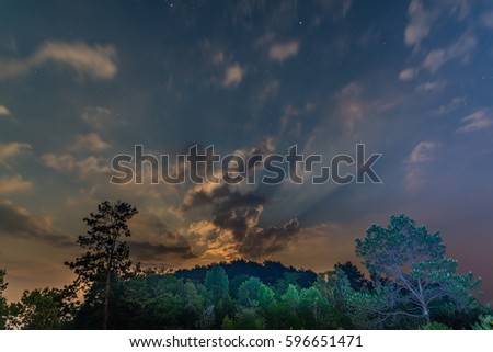 Starry sky view during moonrise in national park of Thailand
