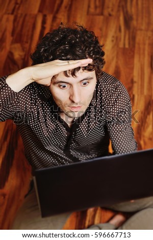 young guy looking for signs of disease on the Internet. Cyberchondria