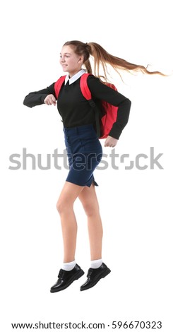 Teenage girl with backpack on white background