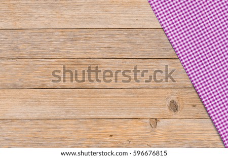 Rustic table cloth on wooden background, top view, copy space.