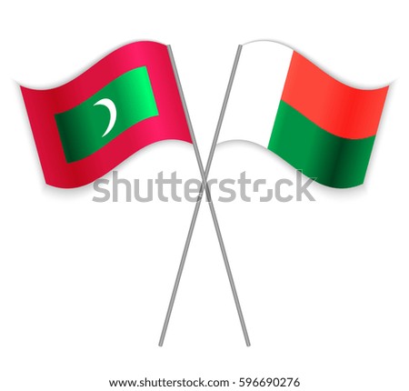 Maldivian and Malagasy crossed flags. Maldives combined with Madagascar isolated on white. Language learning, international business or travel concept.