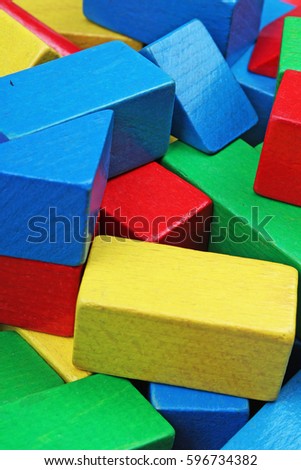 Wooden toy blocks background. Red, Blue, Yellow Green Wooden toy blocks on white background. Wood block texture pattern.