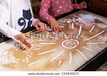 Children's hands on the sand, sand animation