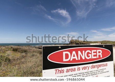 Danger Sign/ the danger sign at The Bluff along 90 mile beach, Far North, NZ 