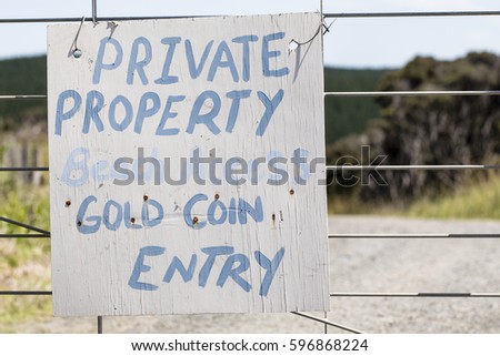Private Property Sign/ A private property sign denoting paid access to a beach 