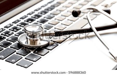 doctor workplace with a stethoscope and laptop
