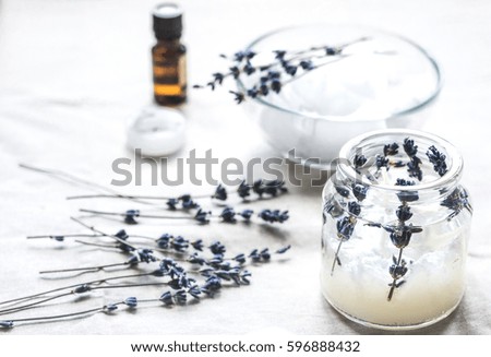 handmade candles with lavender on textile background