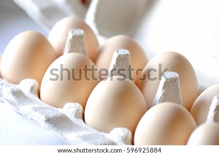 Closeup of eggs in carton