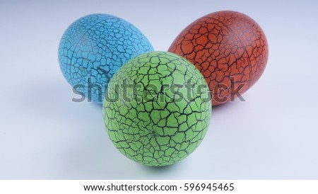 Closeup of colourful painted eggs on white background