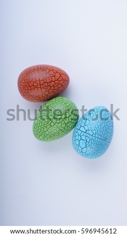 Closeup of colourful painted eggs on white background