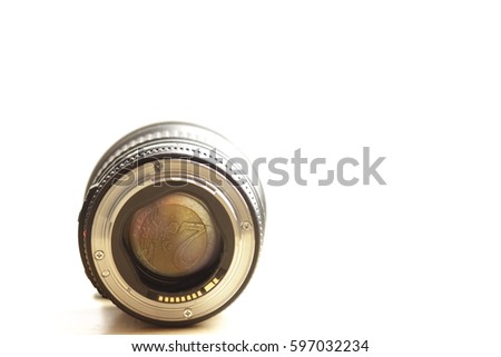 view on euro coin through prime lens in front of white background - coin fills field of view - shallow depth of field