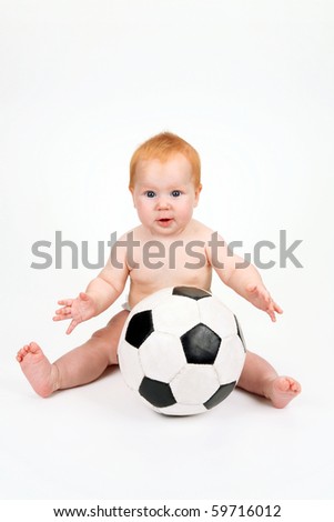The child playing with a ball on a white background