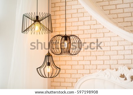 three modern black lamps hanging Royalty-Free Stock Photo #597198908