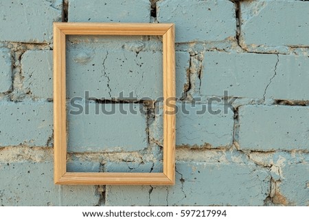 Brick wall texture background with picture frame. Macro shot.