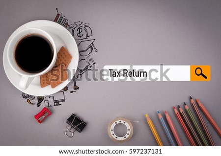 tax return concept. Gray office desk with the inscription