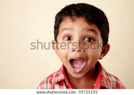 Excited face of a small boy Royalty-Free Stock Photo #59725192