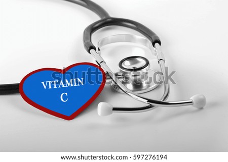 Black and white Stethoscope and red love with medical conceptual text "VITAMIN C"