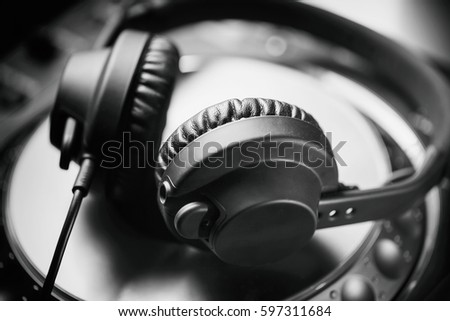 Dj headphones on turntable player.Professional headphone set for disc jockey.Curated collection of royalty free images with music on shutterstock.