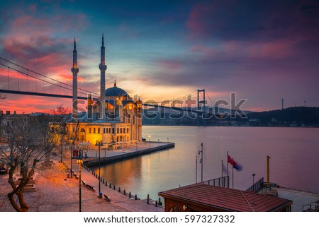 Istanbul. Image of Ortakoy Mosque with Bosphorus Bridge in Istanbul during beautiful sunrise. Royalty-Free Stock Photo #597327332