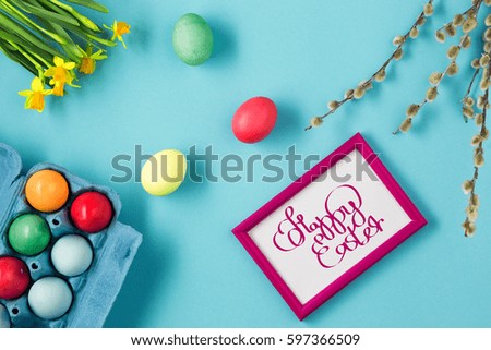 The top view of easter on blue table office workplace