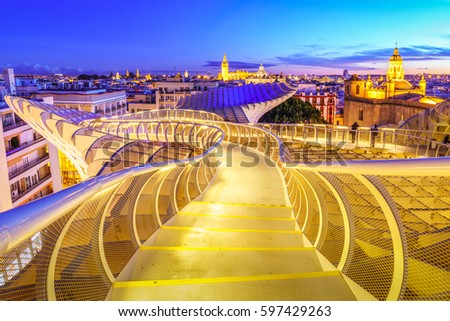 From the top of the Space Metropol Parasol (Setas de Sevilla) one have the best view of the city of Seville, Spain. It provides a unique angle over the old city center and the cathedral. Royalty-Free Stock Photo #597429263