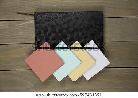 notepad with sticker on wood background