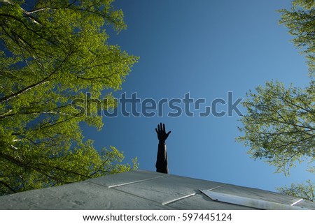 Cast iron hand of Lenin on the clear sky background