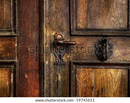 an old wood door with metal handle