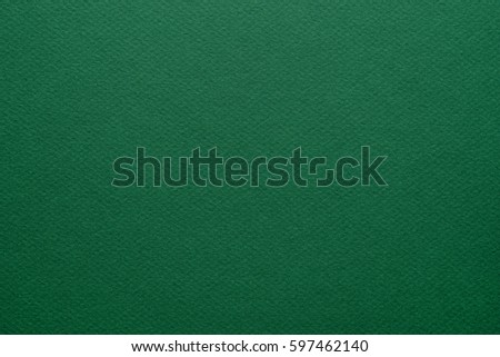 Green paper background. Grain texture art paper in a high resolution. Emerald green. Fine arts paper.