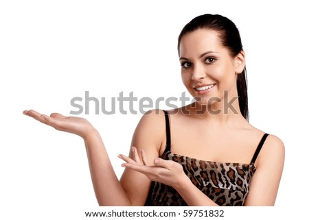A young beautiful woman pointing at copyspace