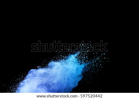 abstract powder splatted background. Blue powder explosion on black background. Colored cloud. Colorful dust explode. Paint Holi.