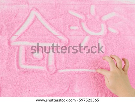 House painted children's hands on the decorative sand. Children's educational creative concept.