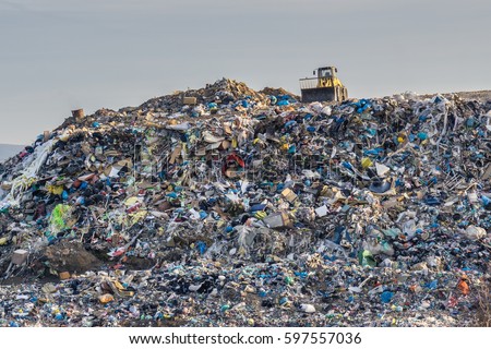 Pollution concept. Garbage pile in trash dump or landfill. Royalty-Free Stock Photo #597557036