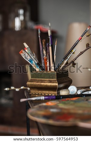 Artist's accessories, painter in retro interior