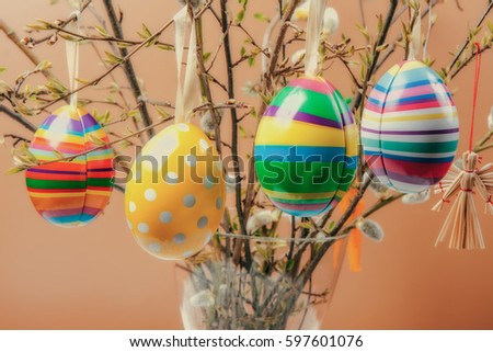 Colourful Easter eggs hanging on a bush