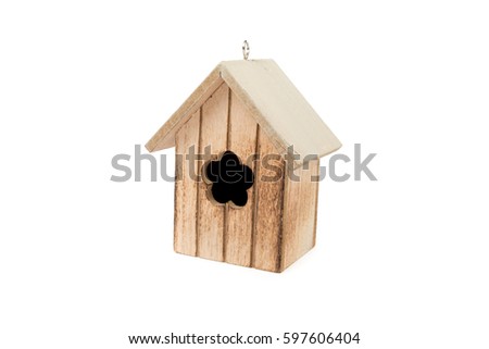 Cute wooden house. Small house with window shape of a flower, prepared from solid wood. Easter greeting decoration. Interior, garden decor. Bird cage isolated on white background. Front, side view.