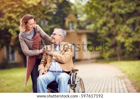 senior man in wheelchair with happy caregiver daughter
 Royalty-Free Stock Photo #597617192