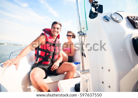 Young Couple On Boat Royalty-Free Stock Photo #597637550