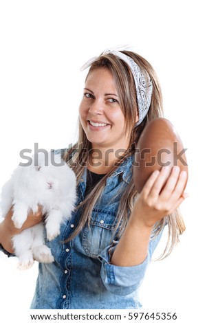 Happy woman holding big chocolate Easter egg with bunny
