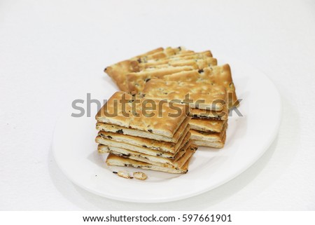 Selective focus of Sultanas biscuits on white isolated background