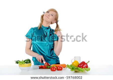 Happy girl in the kitchen. Isolated on white background