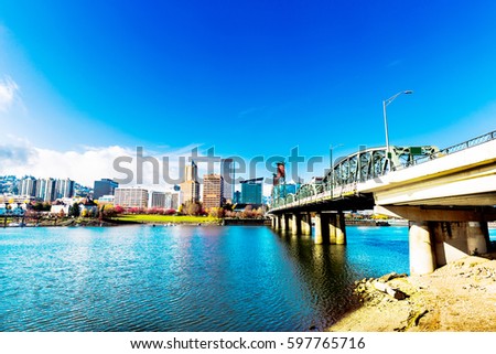 steel bridge and cityscape of portland in blue sky