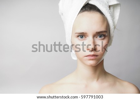 Beautiful woman with towel on the head looking to camera,smile