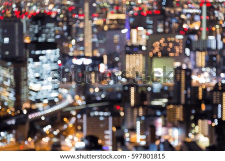 Night blurred bokeh light Osaka office building abstract background