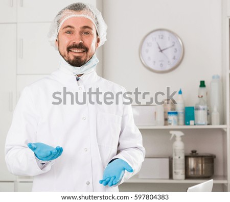 Young male nurse ready to make injection in hospital