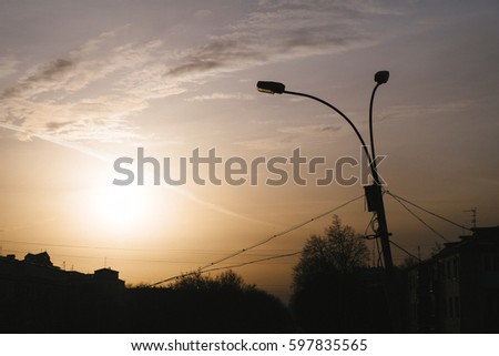 beautiful scene of sunset, silhouette, the sun and shadow of city. a beautiful picture taken against sunlight best for background uses also you can put this image into a category of black and white.