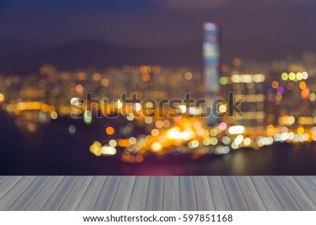 Opening wooden floor, Hong Kong city aerial view blurred bokeh light night view, abstract backgroud