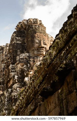 Smiling faces of the Bayon, Khmer temple at Angkor in Cambodia. Official state temple of the Mahayana Buddhist King Jayavarman VII